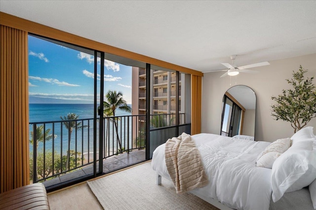 4327 Lower Honoapiilani Rd Unit 801, Lahaina, HI 96761 - bedroom featuring a water view, access to outside, wood finished floors, and arched walkways