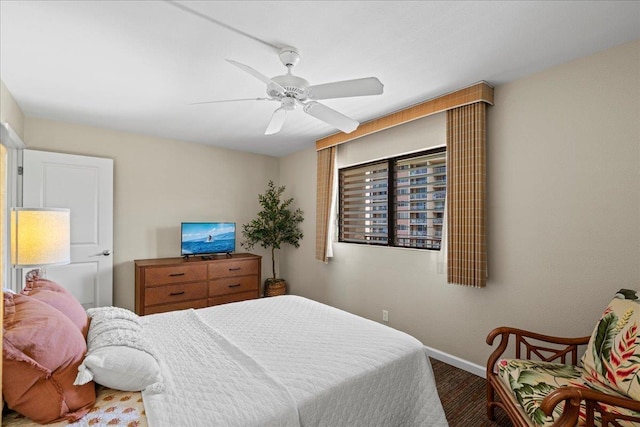 4327 Lower Honoapiilani Rd Unit 802, Lahaina, HI 96761 - bedroom with baseboards, a ceiling fan, and wood finished floors