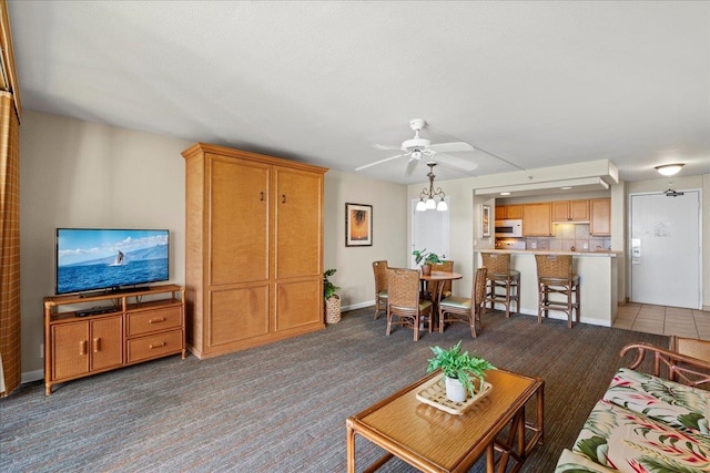 4327 Lower Honoapiilani Rd Unit 802, Lahaina, HI 96761 - living area featuring a ceiling fan, carpet flooring, and baseboards