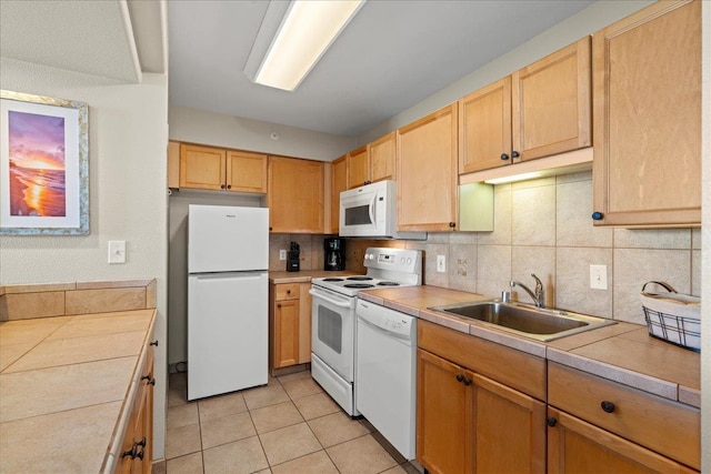 4327 Lower Honoapiilani Rd Unit 802, Lahaina, HI 96761 - kitchen featuring white appliances, tile counters, a sink, and backsplash