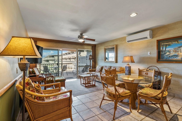 tiled dining space with a wall mounted AC and ceiling fan