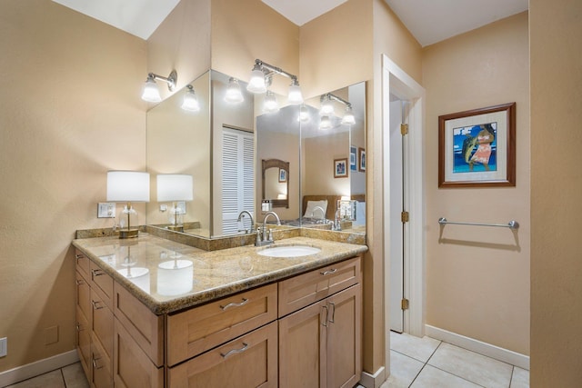 bathroom with tile patterned flooring and vanity