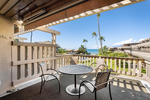 balcony featuring a water view