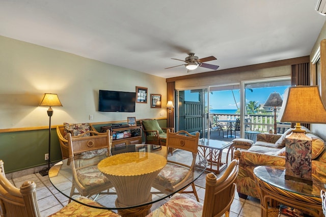 tiled living room featuring ceiling fan