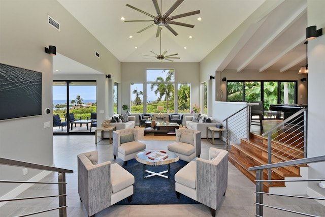 living room featuring light tile patterned flooring, ceiling fan, high vaulted ceiling, and a wealth of natural light