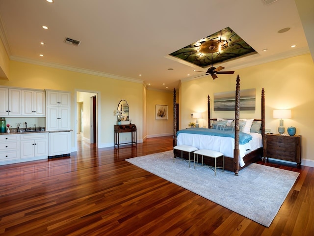 bedroom featuring crown molding, sink, and dark wood-type flooring