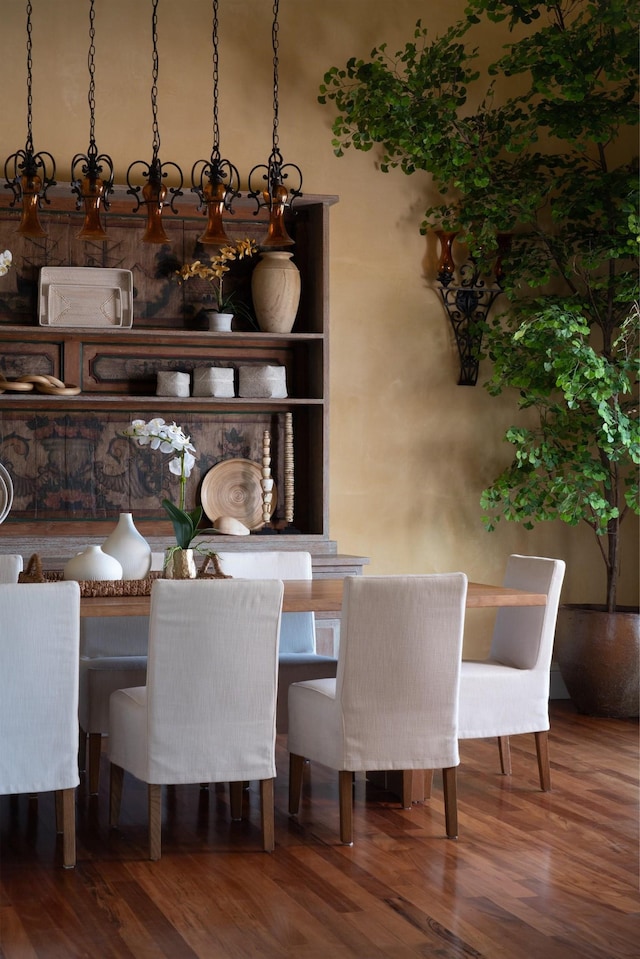 dining area with hardwood / wood-style floors