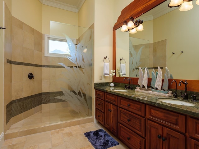 bathroom featuring tiled shower, vanity, and crown molding