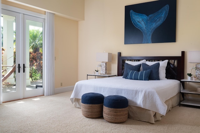 carpeted bedroom with access to exterior and french doors