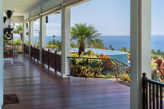 wooden deck featuring a water view