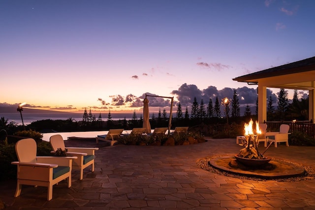 patio terrace at dusk with a water view