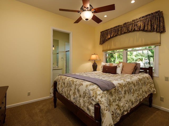 carpeted bedroom featuring ensuite bath and ceiling fan