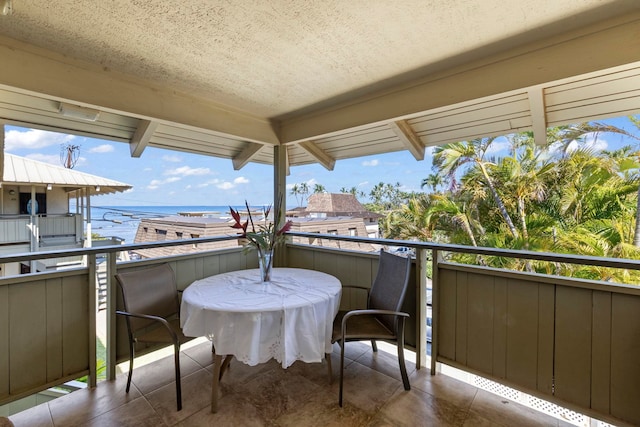 balcony featuring a water view