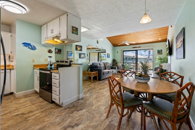 kitchen featuring white cabinets, a textured ceiling, electric range, and hanging light fixtures