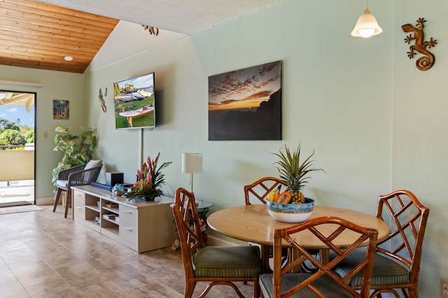 dining area with wooden ceiling and vaulted ceiling