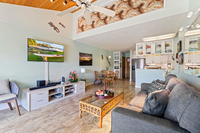 living room with wood ceiling, ceiling fan, and high vaulted ceiling