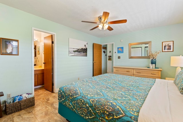 tiled bedroom with ceiling fan and ensuite bathroom