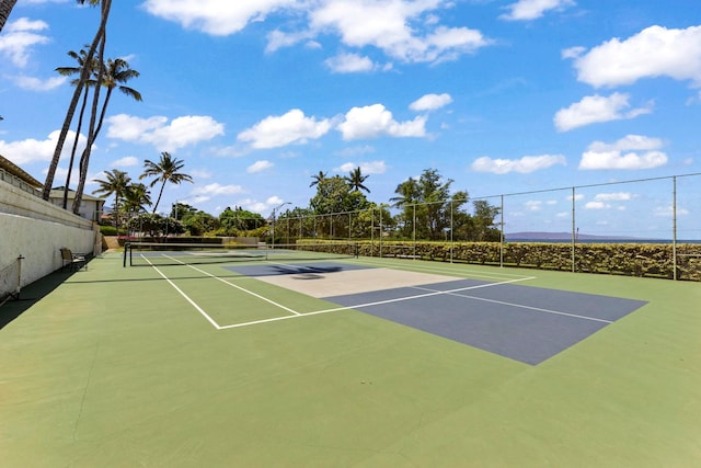 view of tennis court featuring basketball court