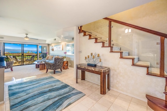 tiled living room featuring ceiling fan