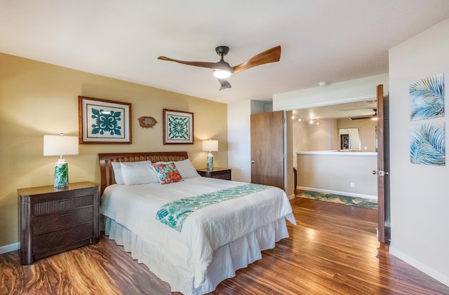 bedroom with hardwood / wood-style floors and ceiling fan