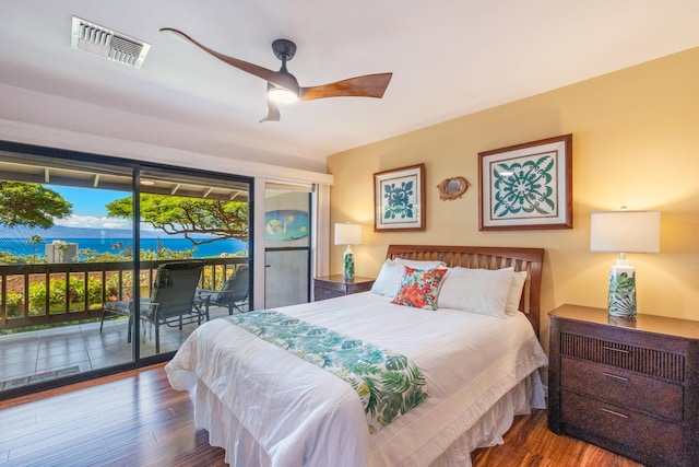 bedroom featuring ceiling fan, access to exterior, and wood-type flooring