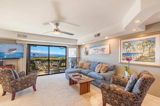 tiled living room featuring ceiling fan