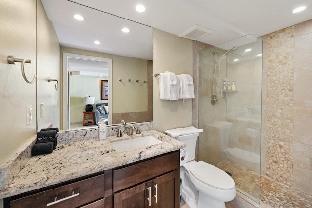 full bathroom featuring vanity, toilet, recessed lighting, and walk in shower