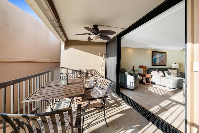 balcony featuring outdoor dining space and ceiling fan