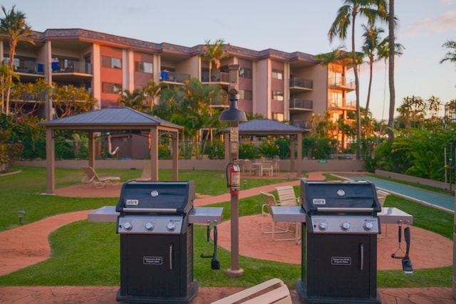 view of property's community featuring a gazebo and a lawn