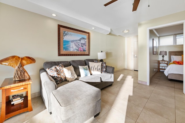 living area featuring baseboards, light tile patterned floors, recessed lighting, and a ceiling fan
