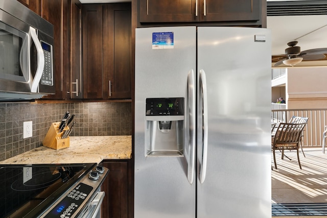 kitchen featuring backsplash, dark brown cabinets, stainless steel appliances, and a ceiling fan