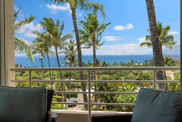 balcony featuring a water view