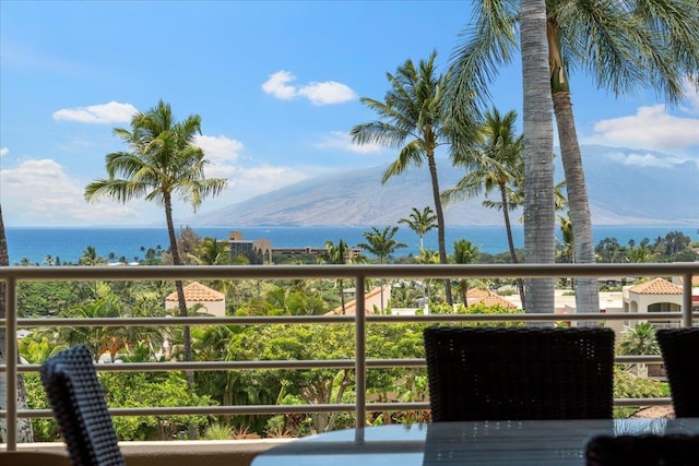 balcony with a water and mountain view