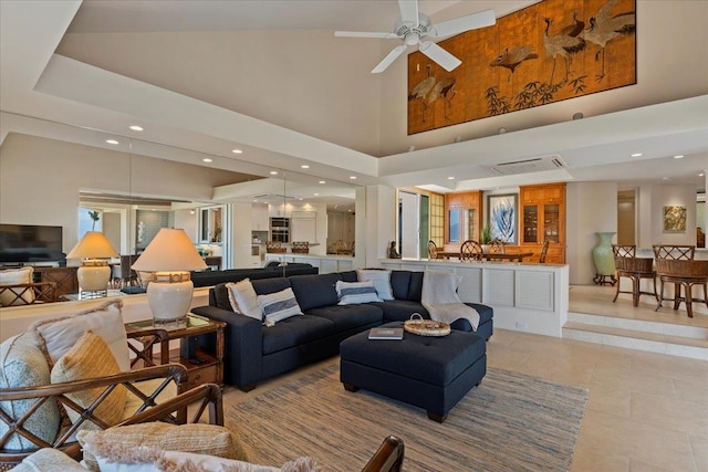 living room with light tile patterned floors and ceiling fan