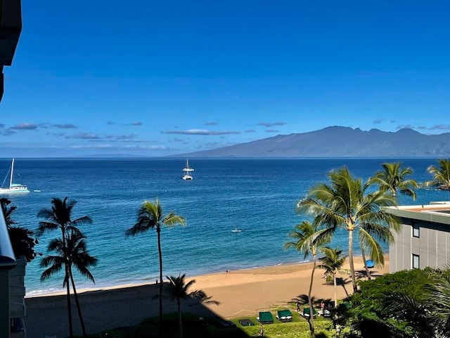 water view featuring a beach view and a mountain view