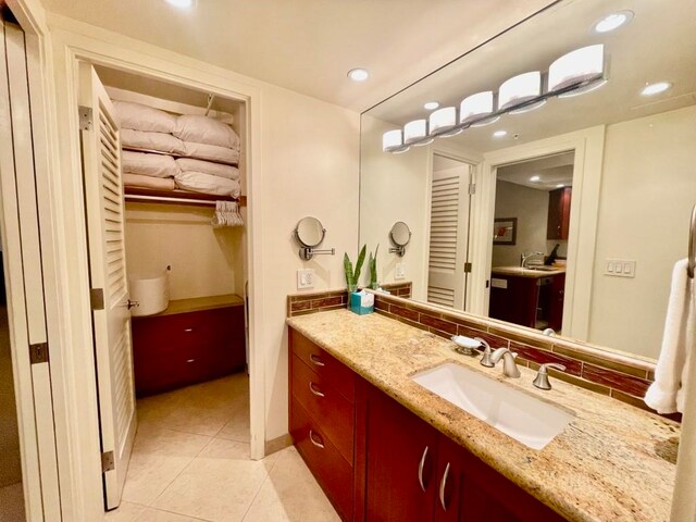 bathroom with vanity and tile patterned floors