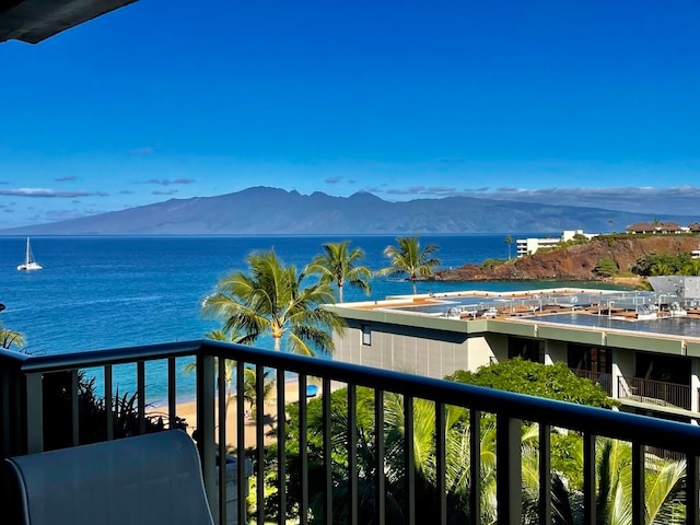 balcony with a water and mountain view