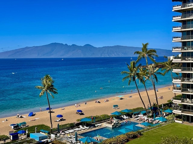 water view with a beach view and a mountain view