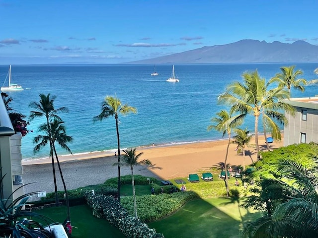 view of water feature featuring a mountain view and a beach view