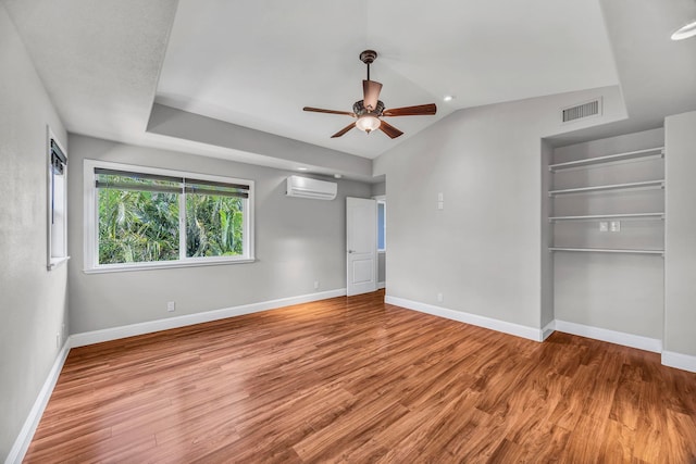 207 Kahana Ridge Dr Unit 132, Lahaina, HI 96761 - spare room featuring a wall mounted AC, wood finished floors, a ceiling fan, and baseboards