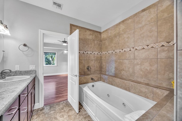 207 Kahana Ridge Dr Unit 132, Lahaina, HI 96761 - bathroom featuring vanity, baseboards, and a ceiling fan