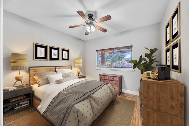 207 Kahana Ridge Dr Unit 132, Lahaina, HI 96761 - bedroom with wood finished floors, baseboards, and a ceiling fan