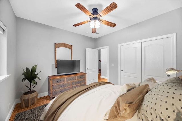 207 Kahana Ridge Dr Unit 132, Lahaina, HI 96761 - bedroom featuring wood finished floors, a closet, baseboards, and a ceiling fan