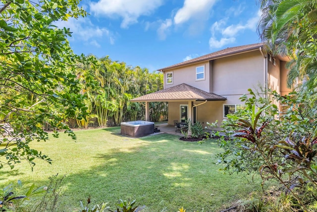 207 Kahana Ridge Dr Unit 132, Lahaina, HI 96761 - view of green lawn featuring a hot tub and a patio area