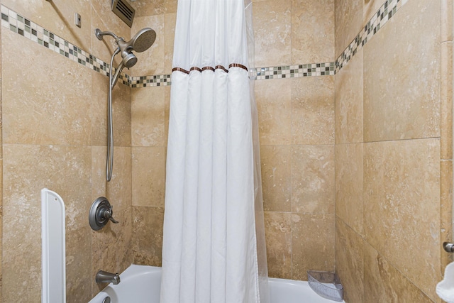 room details with shower / bath combination with curtain