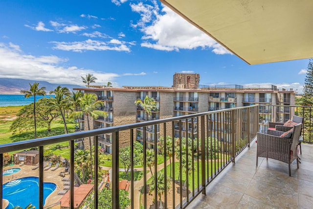 balcony featuring a water view