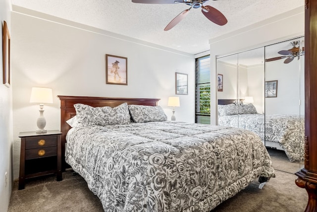 carpeted bedroom with a textured ceiling, a closet, and ceiling fan