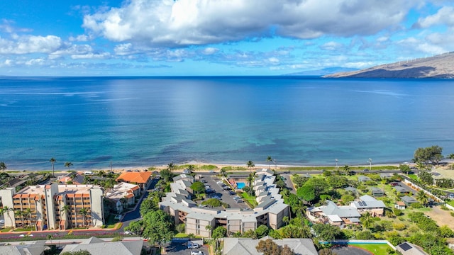 birds eye view of property featuring a water and mountain view