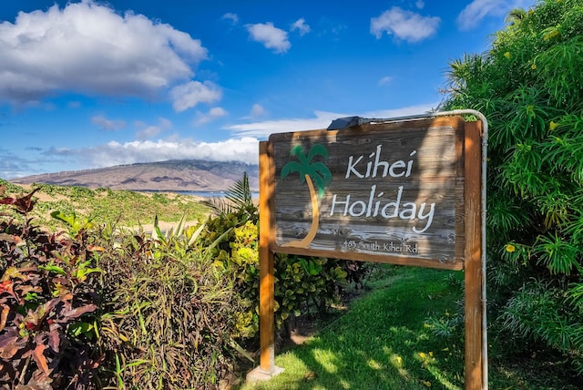 community sign featuring a mountain view