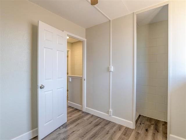3676 Lower Honoapiilani Rd Unit F303, Lahaina, HI 96761 - interior space featuring a closet and hardwood / wood-style floors